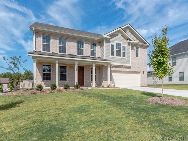 1404 Cilantro Court, Unit 309 Tega Cay, SC 29708 - Photo 1 of 24 a front view of a house with a yard