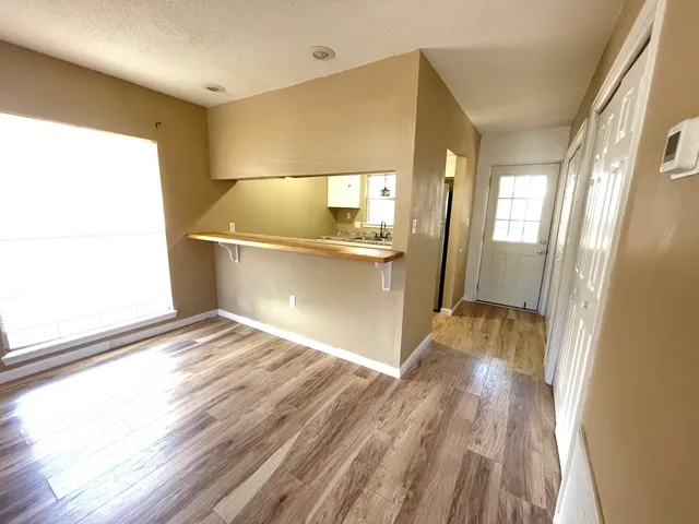 a view of a bathroom with a sink and a window
