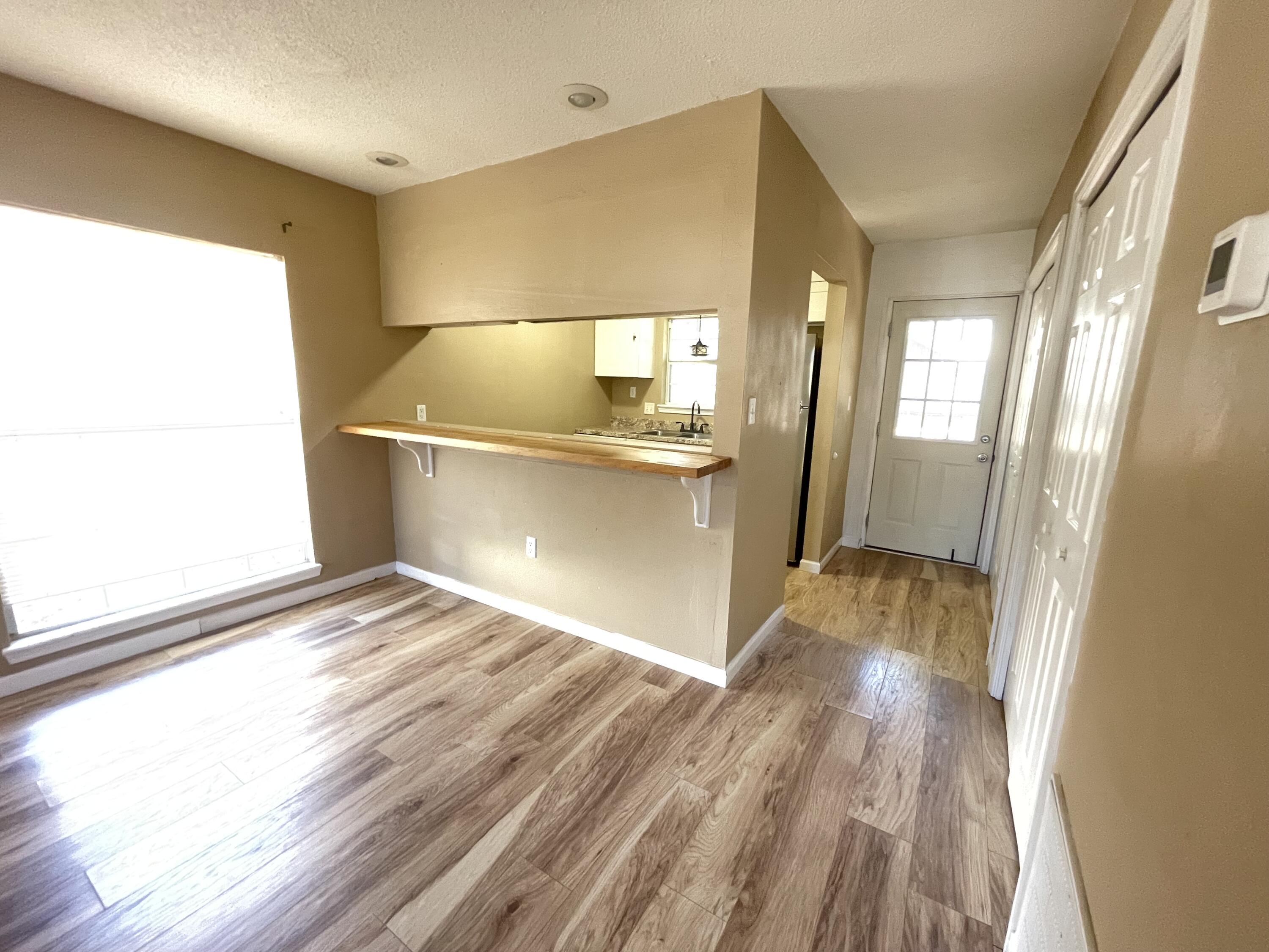 607 West Sunset Boulevard, Unit A Fort Walton Beach, FL 32547 - Photo 9 of 13 a view of a bathroom with a sink and a window