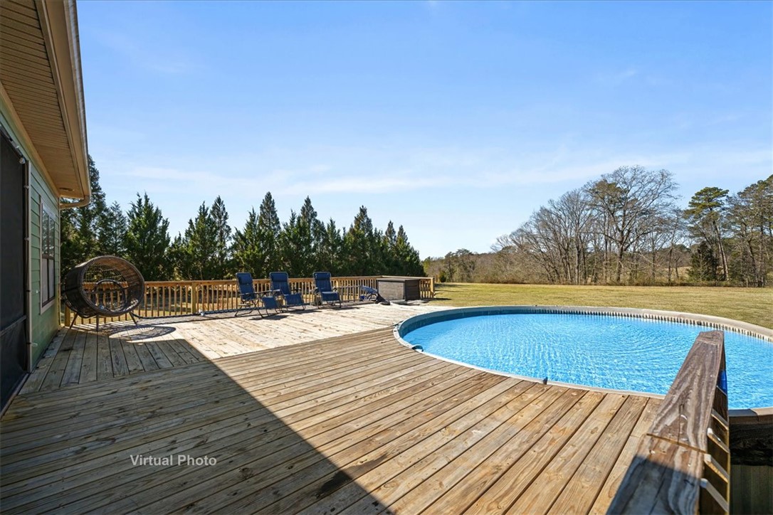 212 Winding Lane Seneca, SC 29672 - Photo 32 of 47 This spacious deck and inviting pool offer an ideal setting for outdoor enjoyment.