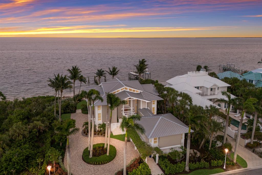 641 Boca Bay Drive Boca Grande, FL 33921 - Photo 45 of 74 an aerial view of a house with a yard and lake view