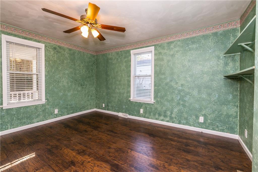 243 Marshall Road Oakdale, PA 15071 - Photo 14 of 24 Another view of the master bedroom located on the main floor. New laminate flooring, freshly painted white baseboards, and ceiling fan with lights.