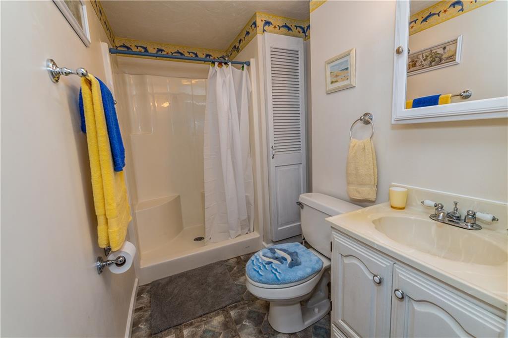 243 Marshall Road Oakdale, PA 15071 - Photo 22 of 24 Full, basement bath with shower, linen closet and large vanity with storage.
