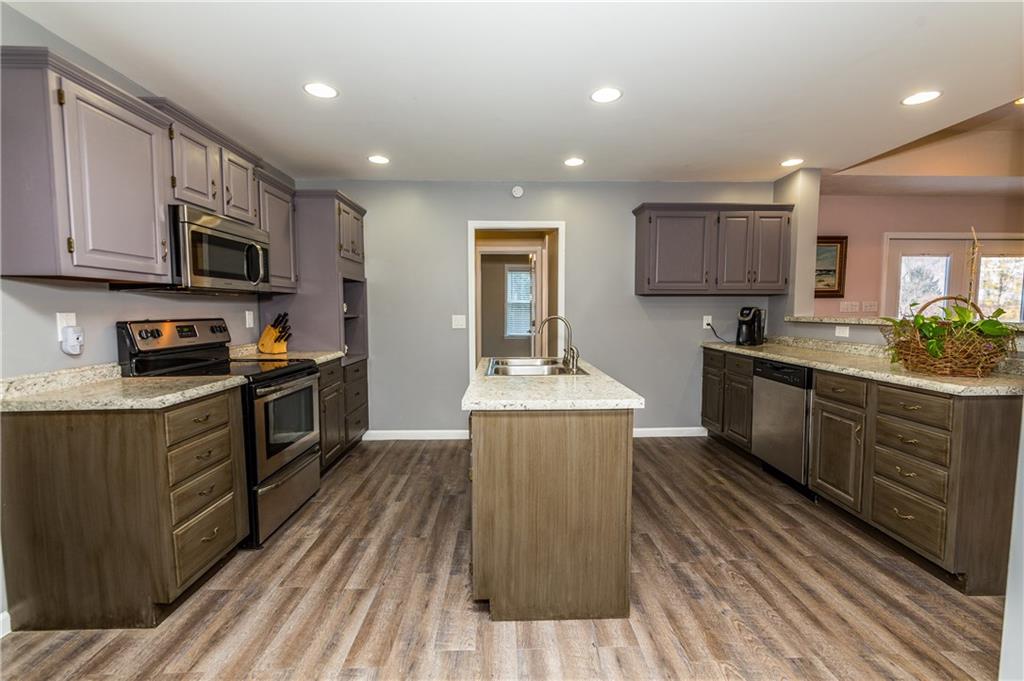 243 Marshall Road Oakdale, PA 15071 - Photo 8 of 24 Another view of this updated, remodeled, gourmet kitchen! Tons of cabinets and drawers offers ample storage. Beyond the tiered island at the right, is the family room.