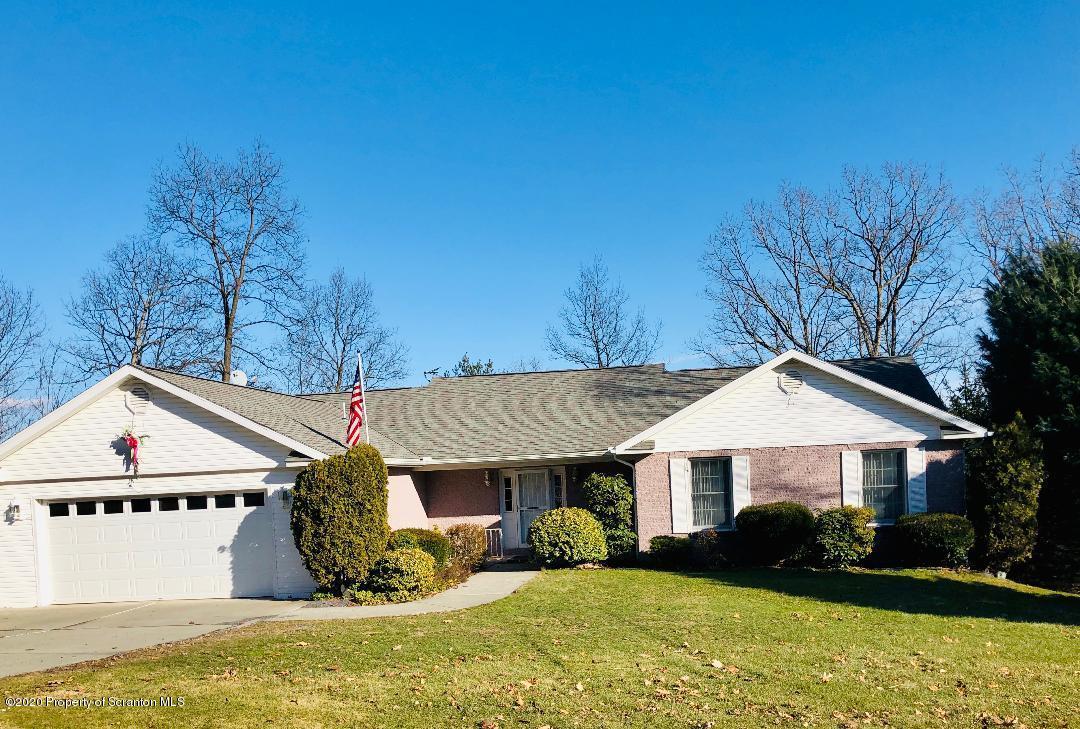 14 Ridgeview Drive Scranton, PA 18504 - Photo 1 of 23 a front view of house with yard and trees in the background