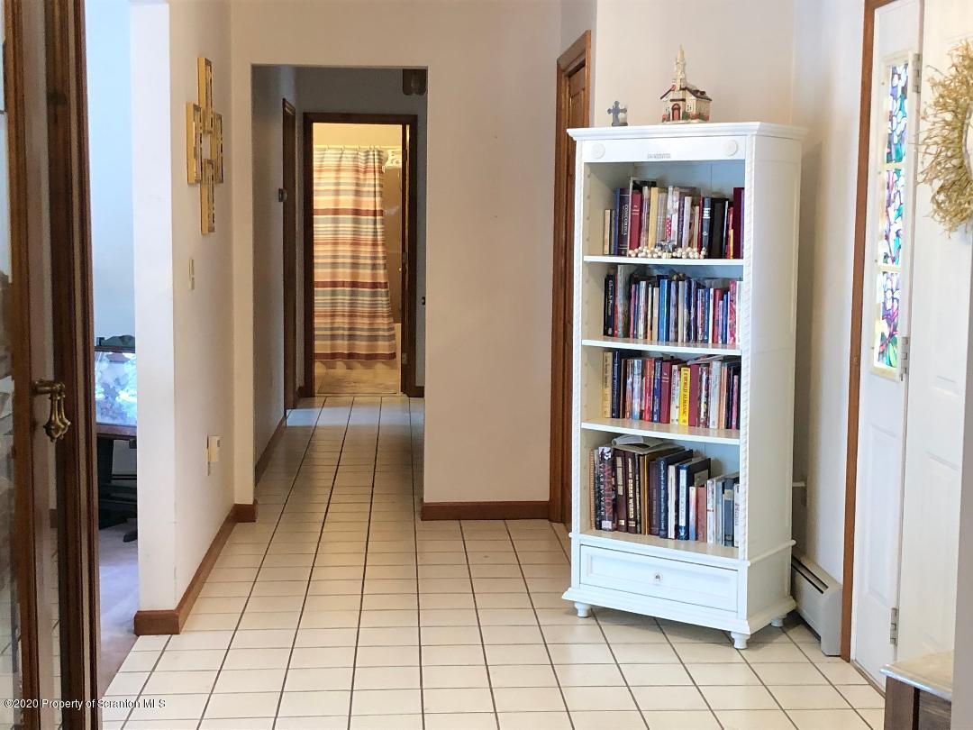 14 Ridgeview Drive Scranton, PA 18504 - Photo 11 of 23 a hallway with a book shelf in it