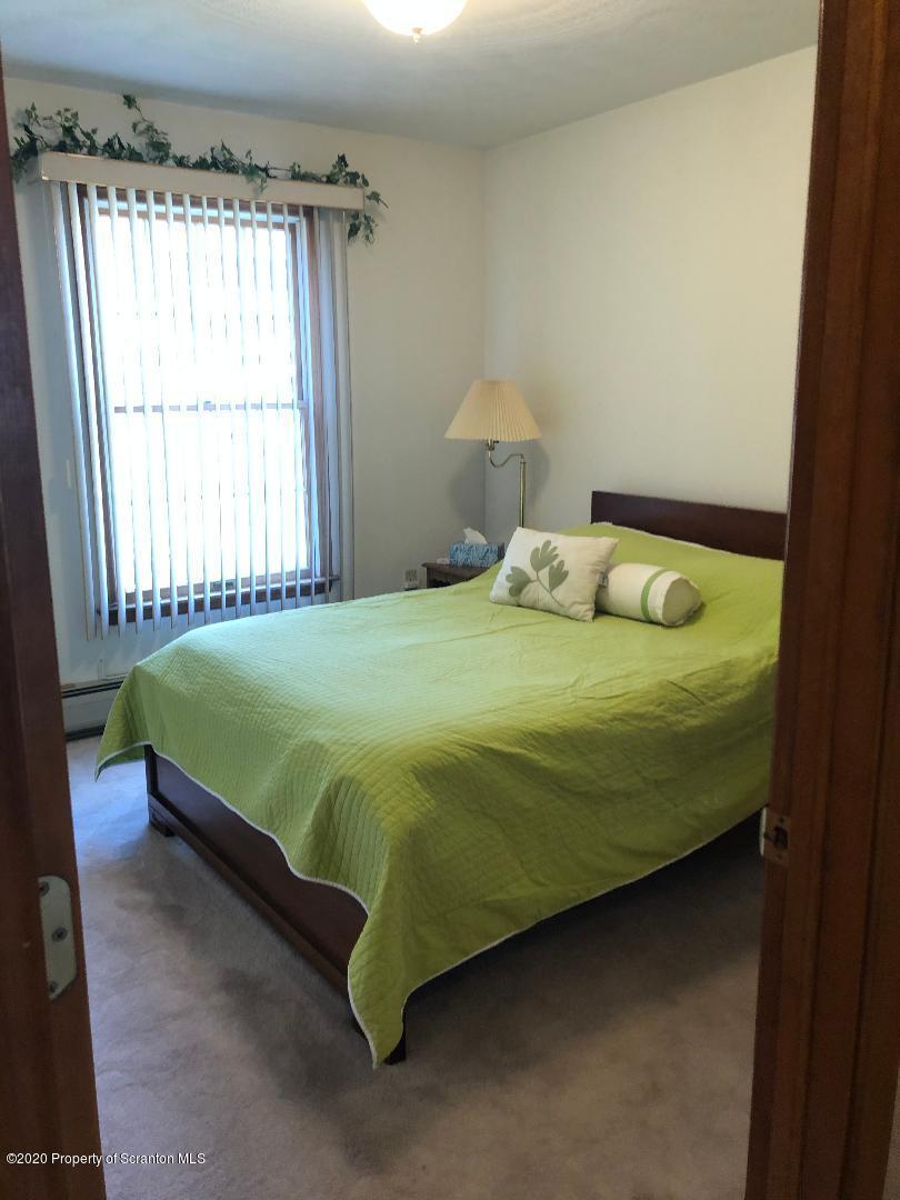 14 Ridgeview Drive Scranton, PA 18504 - Photo 18 of 23 a bedroom with a bed and window
