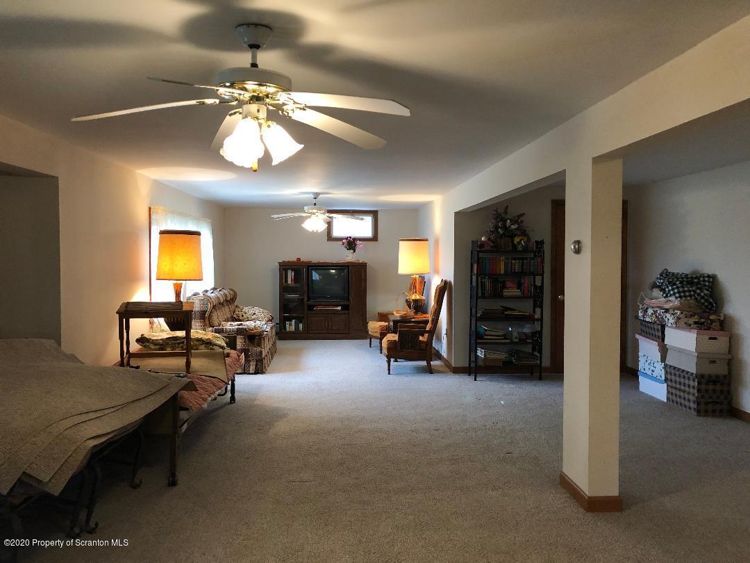 14 Ridgeview Drive Scranton, PA 18504 - Photo 23 of 23 a view of a livingroom with furniture and a ceiling fan