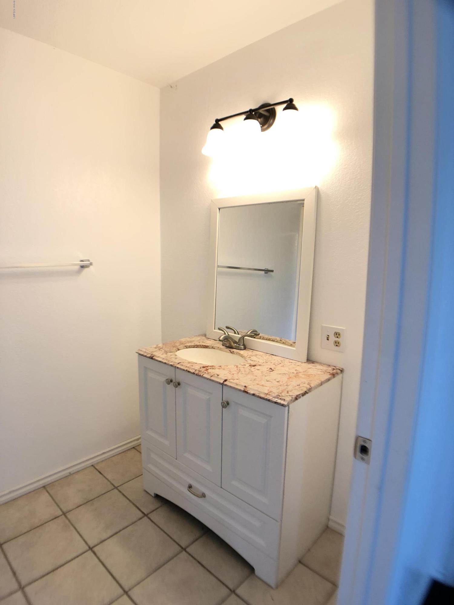 3341 Stone Road Yakima, WA 98908 - Photo 29 of 42 a bathroom with a granite countertop sink and vanity