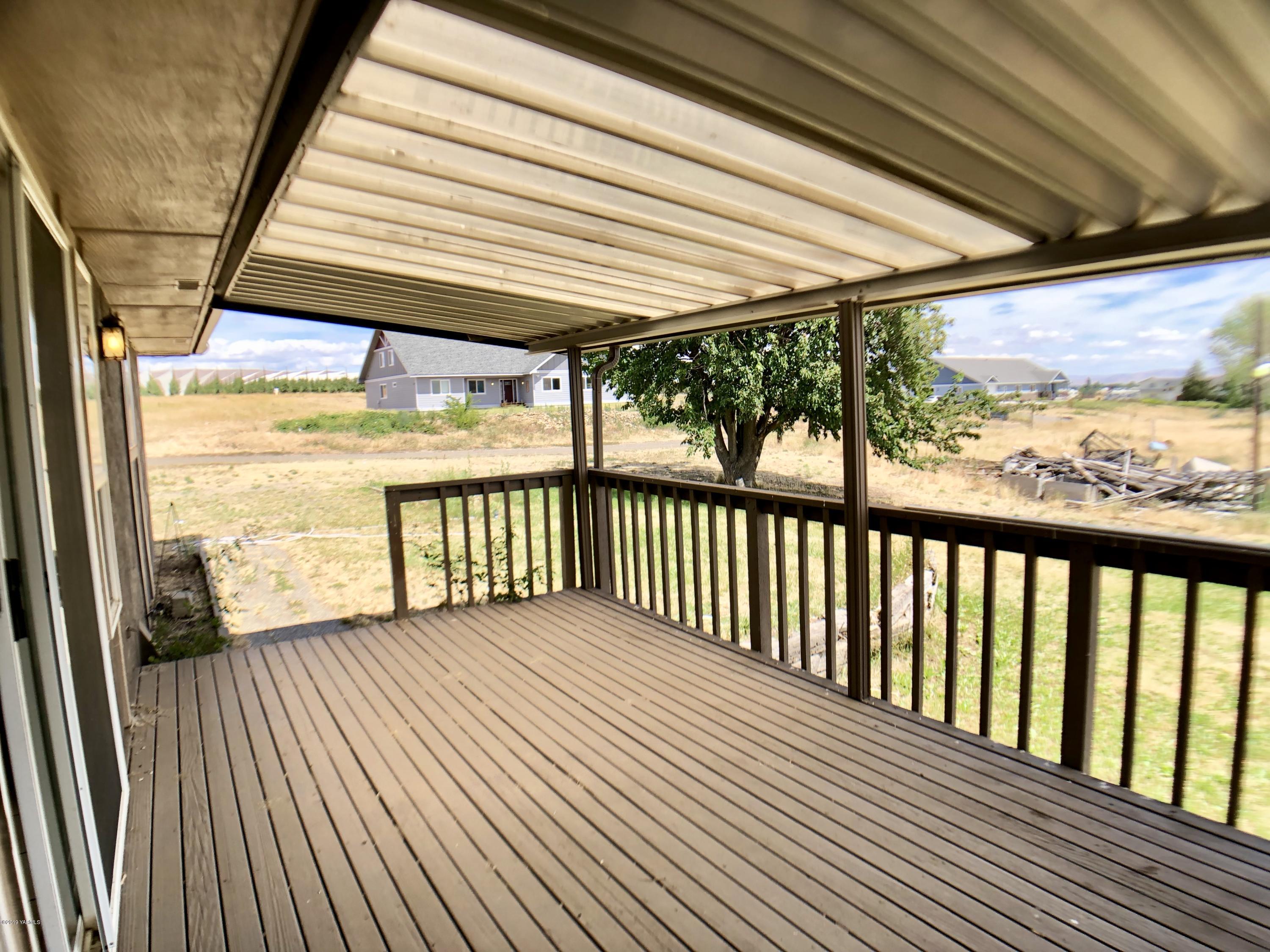 3341 Stone Road Yakima, WA 98908 - Photo 34 of 42 a view of a porch with wooden floor and outdoor space