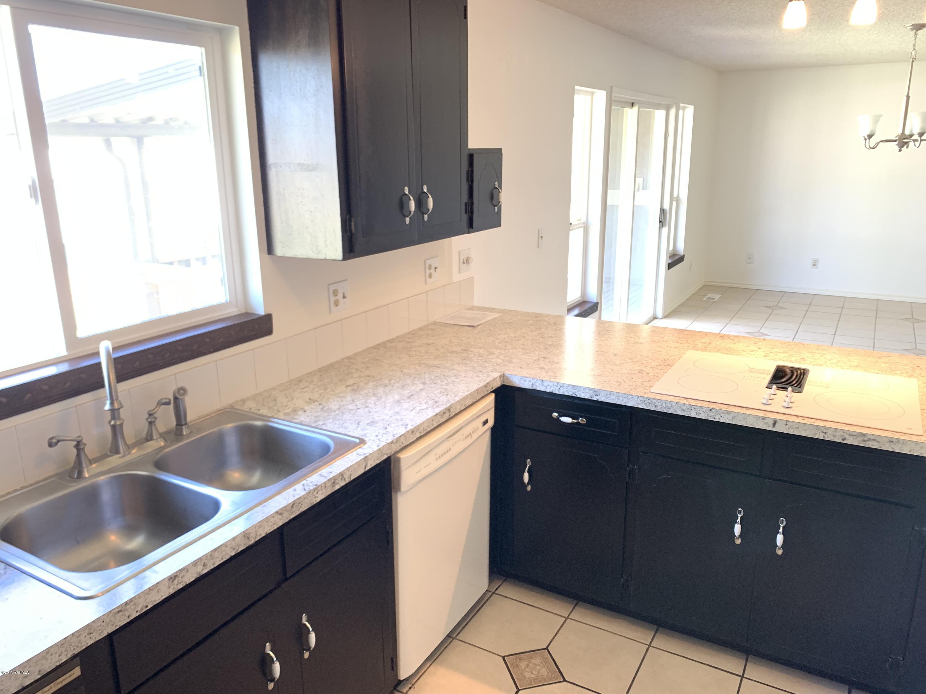 3341 Stone Road Yakima, WA 98908 - Photo 10 of 42 a kitchen with a sink and a window