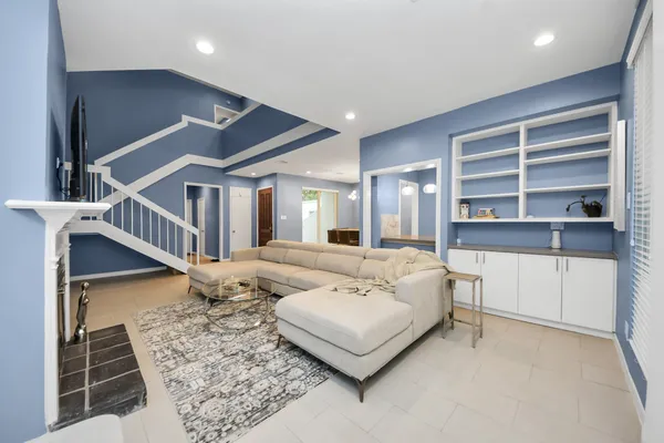 a living room with furniture and a rug