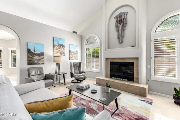 a bathroom with a glass shower door and a sink