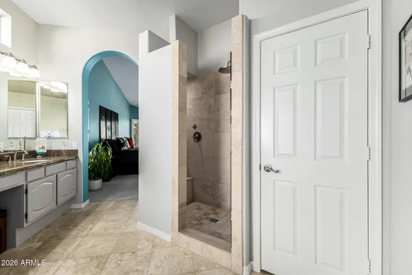 a bathroom with double sink and a mirror