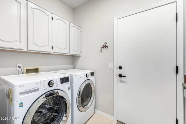 a view of backyard with swimming pool and outdoor seating