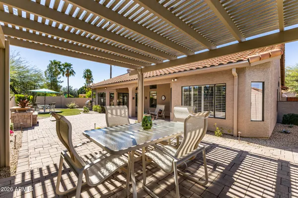a view of a water fountain in front of the house