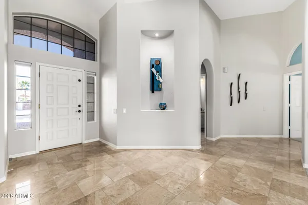 a view of a big room with closet and windows