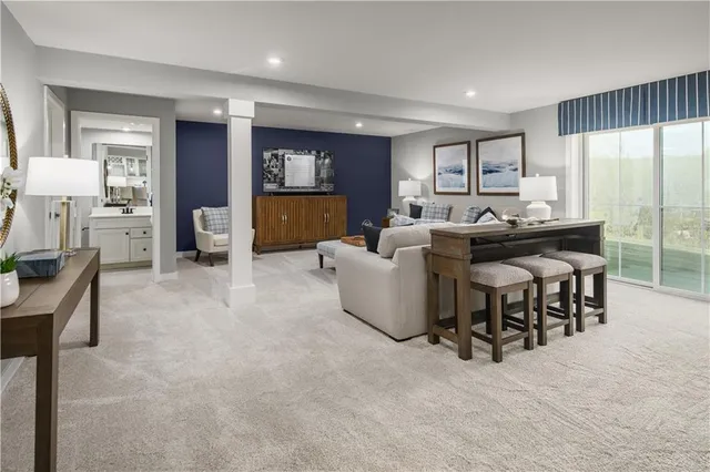 a living room with furniture and a table