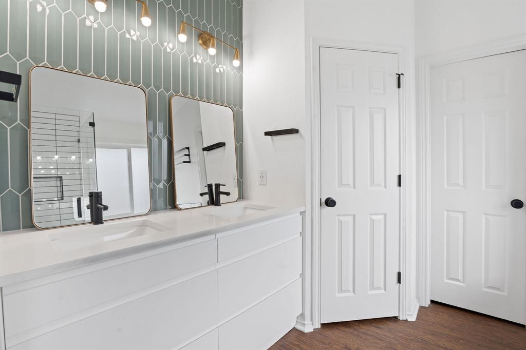 4429 East Hove Loop Austin, TX 78749 - Photo 14 of 27 a bathroom with a double vanity sink and a mirror