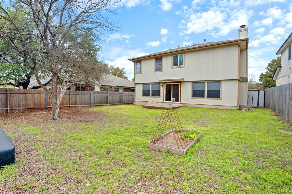 4429 East Hove Loop Austin, TX 78749 - Photo 27 of 27 a view of a house with a yard patio and a slide