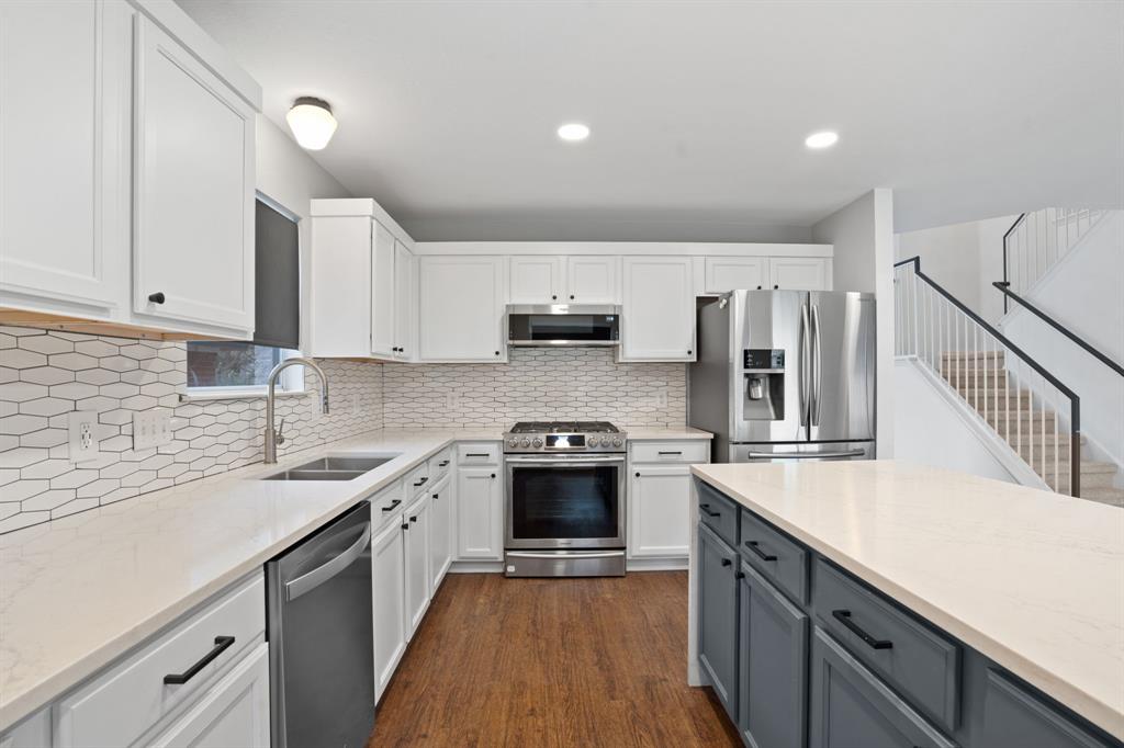 4429 East Hove Loop Austin, TX 78749 - Photo 5 of 27 a kitchen with a sink stove and cabinets
