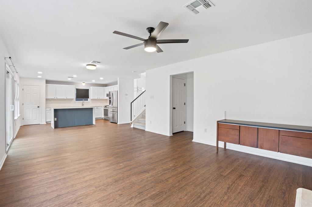 4429 East Hove Loop Austin, TX 78749 - Photo 9 of 27 a view of an empty room with wooden floor and a ceiling fan