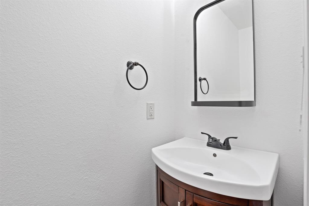 4429 East Hove Loop Austin, TX 78749 - Photo 10 of 27 a bathroom with a sink and mirror