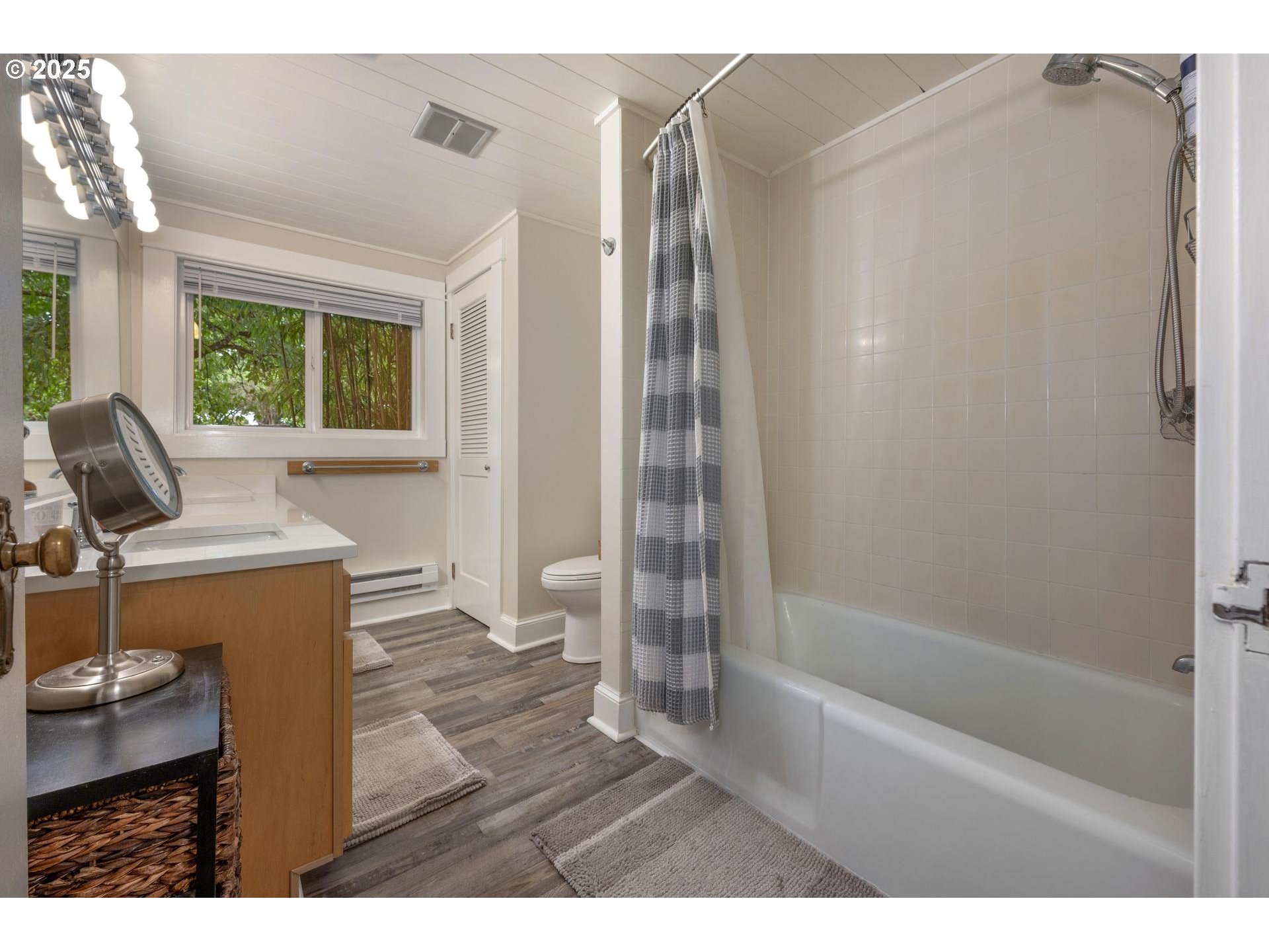 8918 Southwest Grabhorn Road Beaverton, OR 97007 - Photo 18 of 46 a bathroom with a bathtub sink and toilet