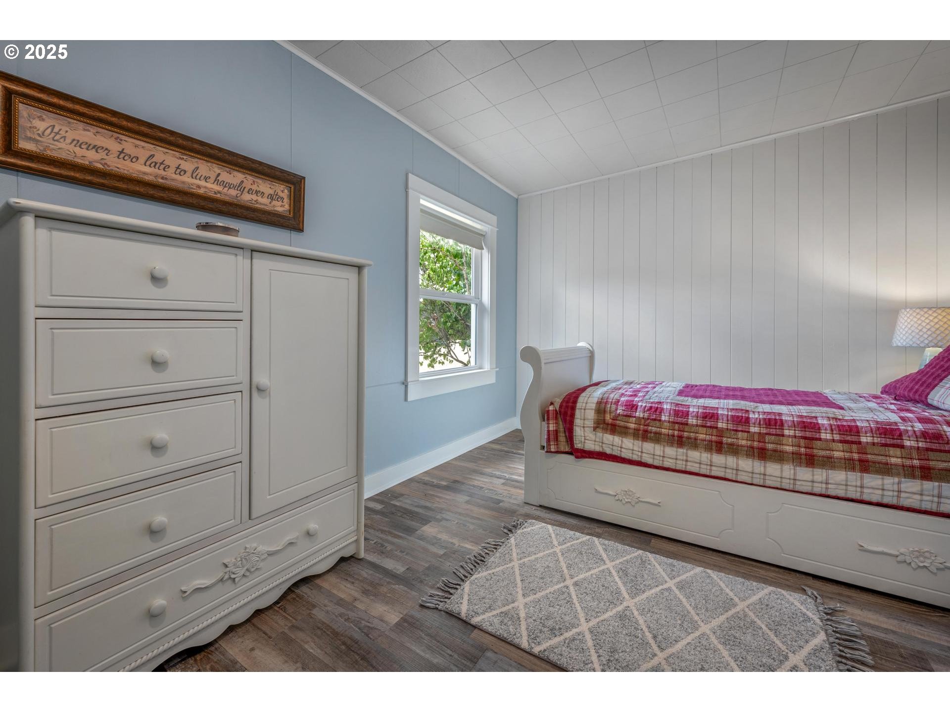 8918 Southwest Grabhorn Road Beaverton, OR 97007 - Photo 20 of 46 a bedroom with a bed and a window