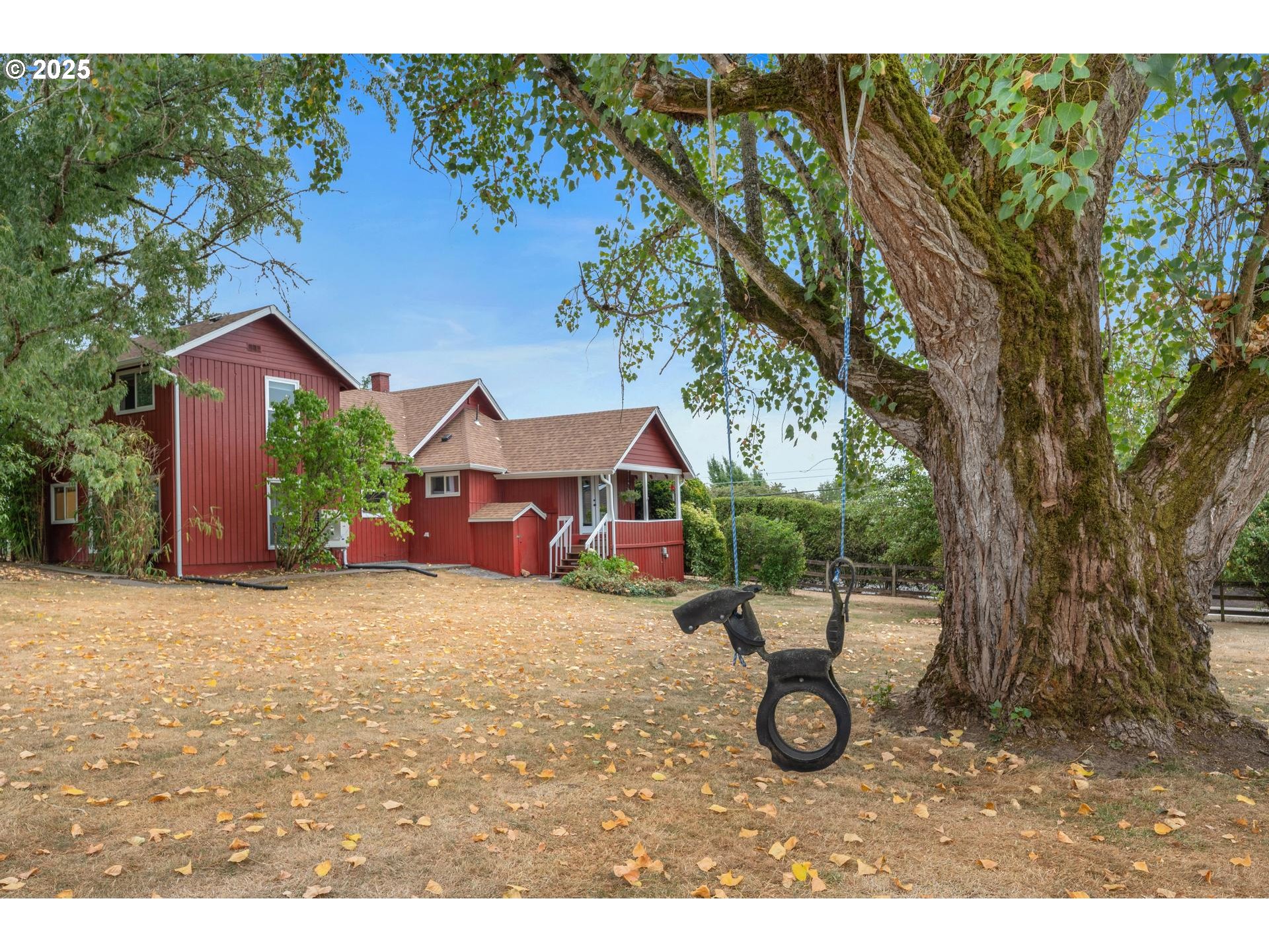 8918 Southwest Grabhorn Road Beaverton, OR 97007 - Photo 28 of 46 a view of a house with a yard and sitting area