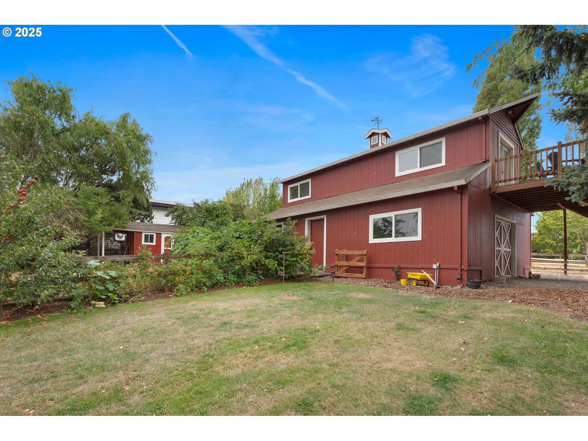 8918 Southwest Grabhorn Road Beaverton, OR 97007 - Photo 35 of 46 a view of a yard in front of a house with large tree