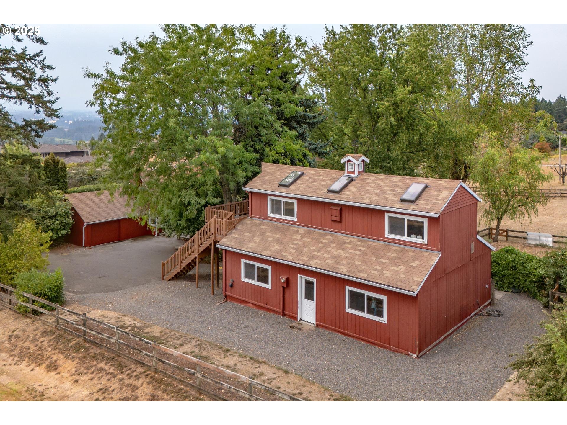 8918 Southwest Grabhorn Road Beaverton, OR 97007 - Photo 37 of 46 an aerial view of a house with a yard
