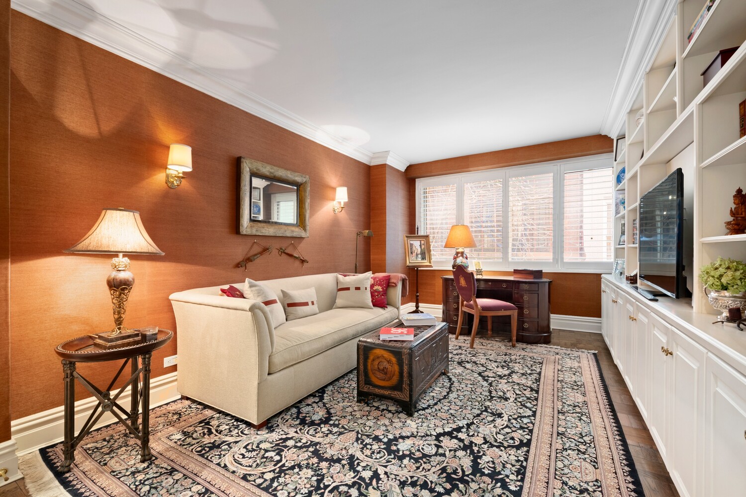 10 East 70th Street, Unit 2B Manhattan, NY 10021 - Photo 7 of 11 a living room with furniture and a flat screen tv