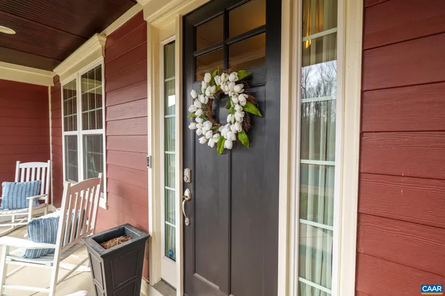 a view of an entryway with wooden floor