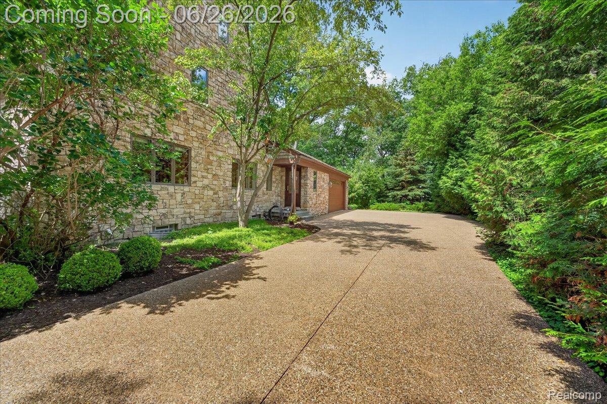 29498 East River Road Grosse Ile, MI 48138 - Photo 52 of 66 29489 E River Road Grosse Ile, MI with Exposed Aggregate Circle Driveway to 3 Car Garage