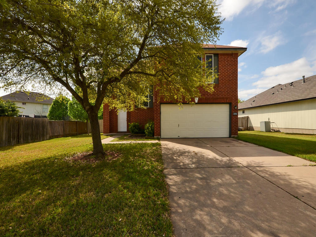 1005 Double File Trail Round Rock, TX 78665 - Photo 1 of 1 a front view of a house with a yard and a tree