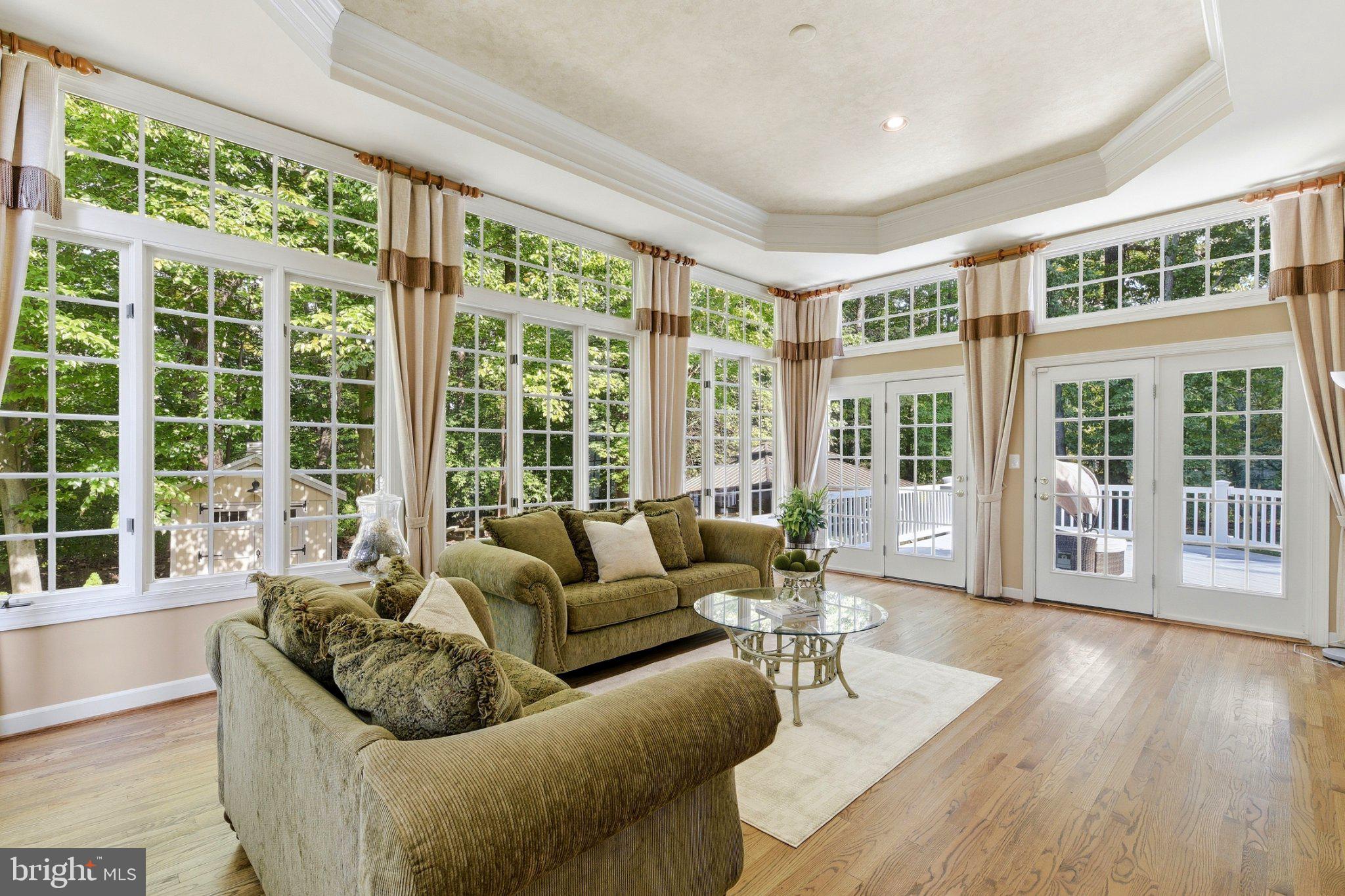 124 Seahawk Lane Edgewater, MD 21037 - Photo 22 of 68 Conservatory with three walls of windows.