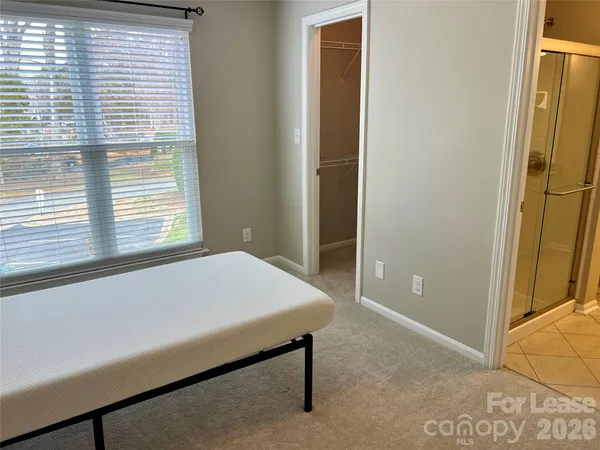 a room with a bed and a window