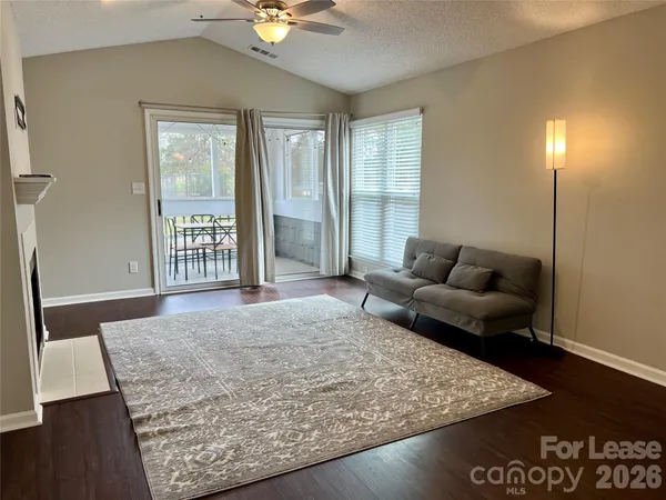 a living room with furniture and a rug