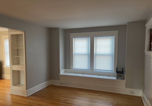 13 Merchant Street Worcester, MA 01603 - Photo 15 of 17 wooden floor and window in a room