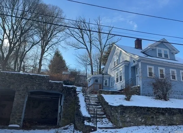 a view of a house with brick walls