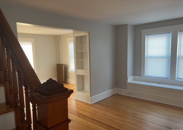 13 Merchant Street Worcester, MA 01603 - Photo 10 of 17 a view of an entryway with wooden floor