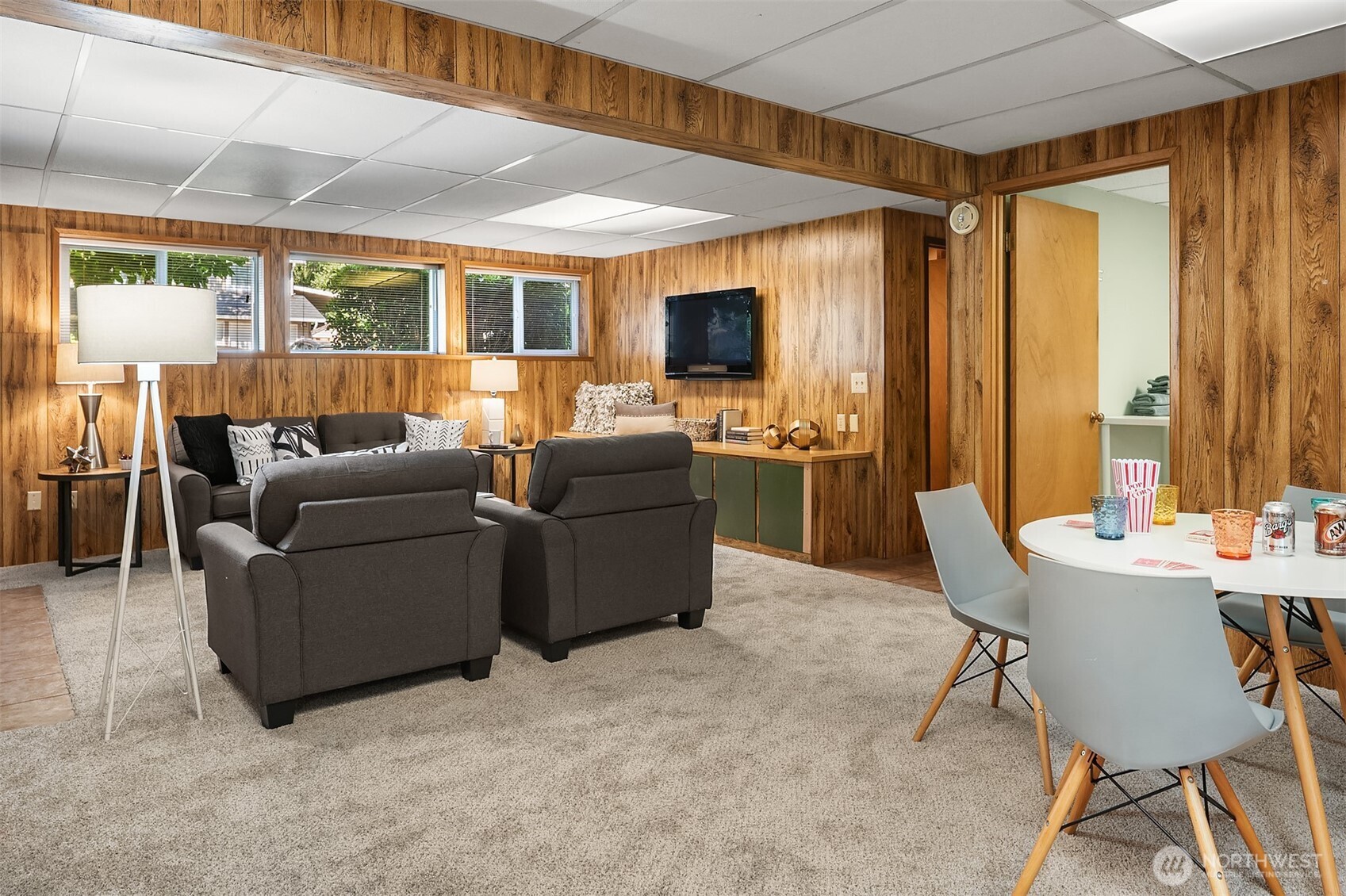 21331 2nd Avenue Southeast Bothell, WA 98021 - Photo 21 of 34 a living room with furniture a flat screen tv and a large window