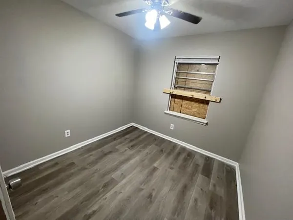 a view of empty room with windows