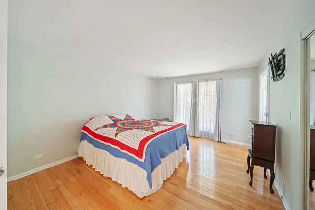 a room with a bed and a chair in it