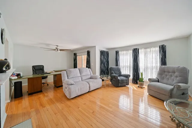 a living room with furniture or couch and a wooden floor
