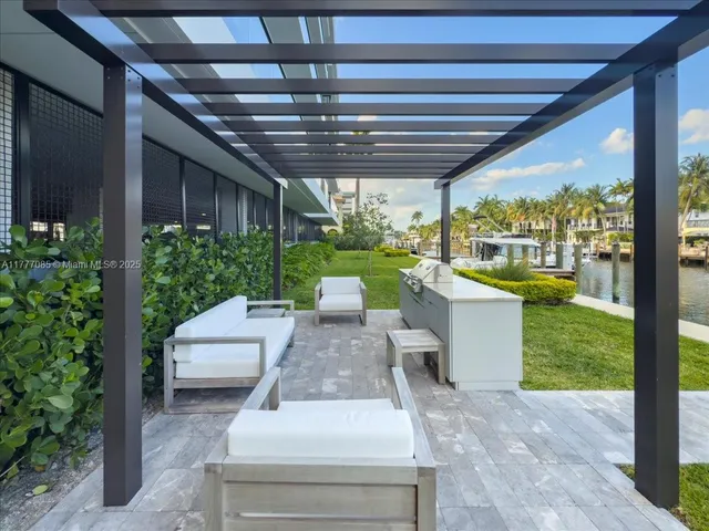 a view of a house with a yard porch and sitting area