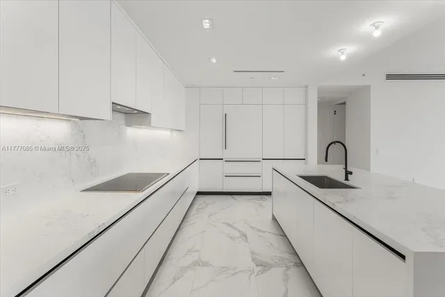 a view of a kitchen with a sink and dishwasher