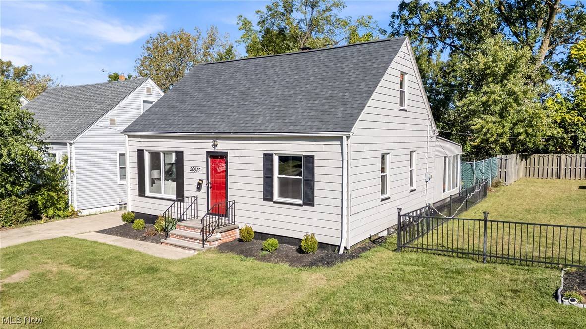 20813 Hansen Road Maple Heights, OH 44137 - Photo 1 of 40 New england style home featuring roof with shingles
