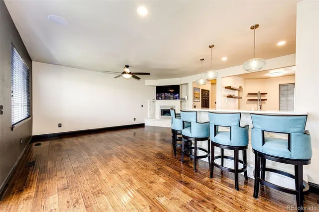 a view of an empty room with a ceiling fan